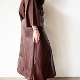 Lai High Waist Asymmetrical Button Skirt in Vegan Leather Mahogany